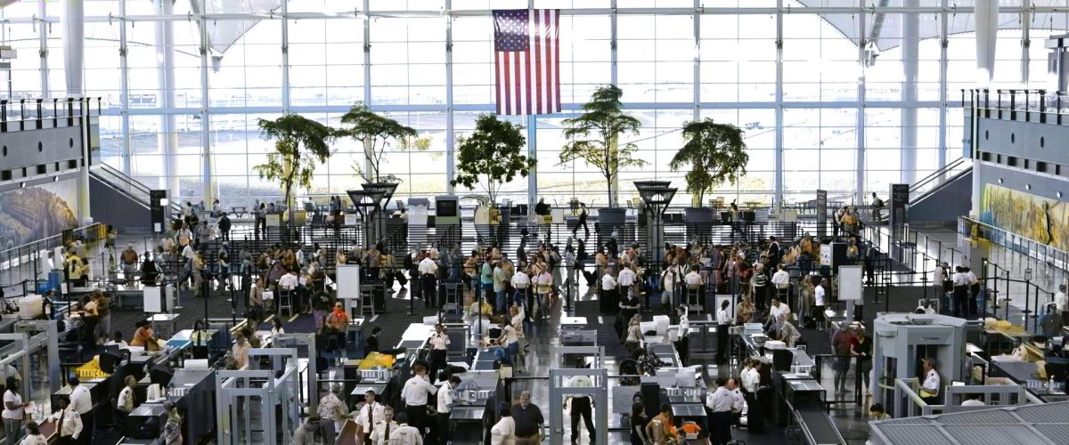 The TSA Security checkpoint at the Denver International Airport in Colorado from a distance, crowded with travelers