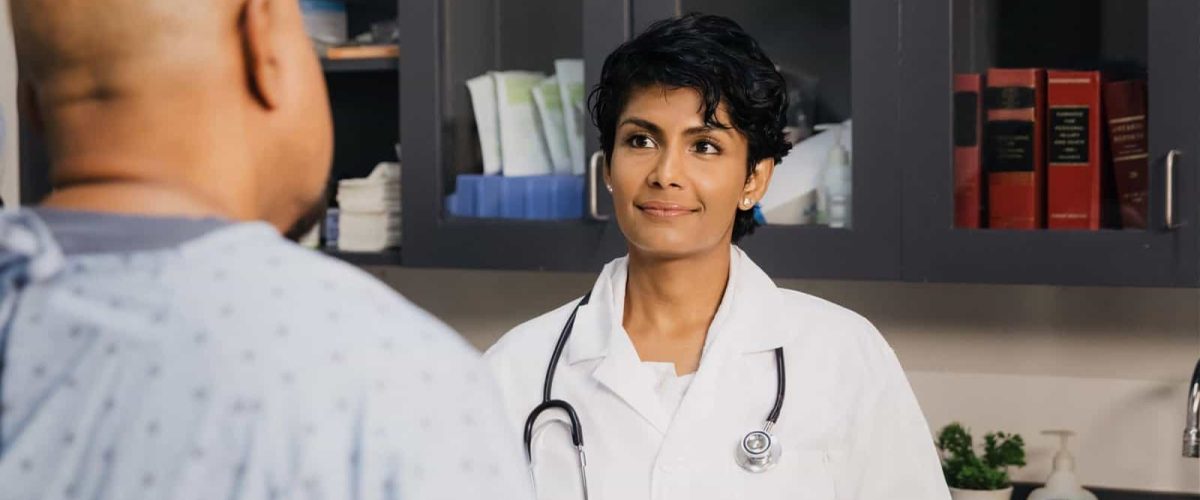doctor-and-patient-in-a-doctor-s-office-wecompress.com_-scaled
