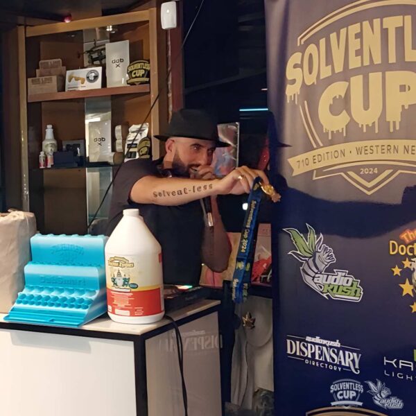 DJ Nikka T. distributes a medal at Solventless cannabis Cup in Buffalo, New York