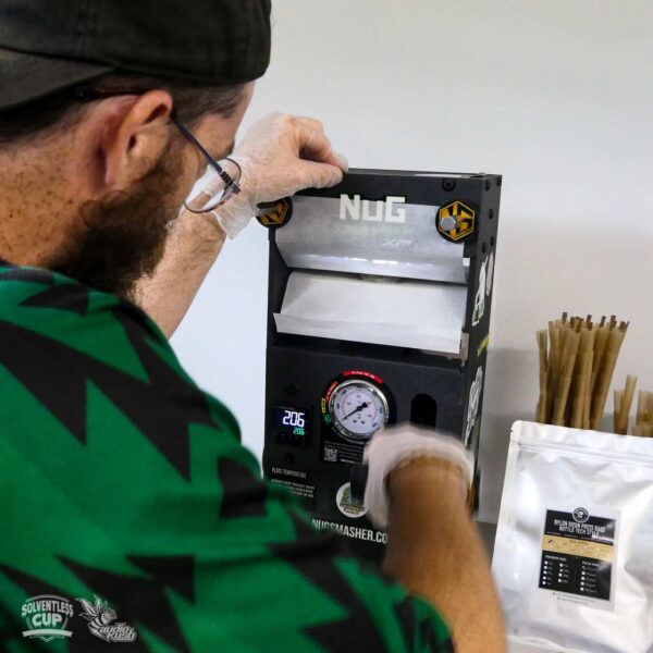Pressing rosin on Nug Smasher rosin press